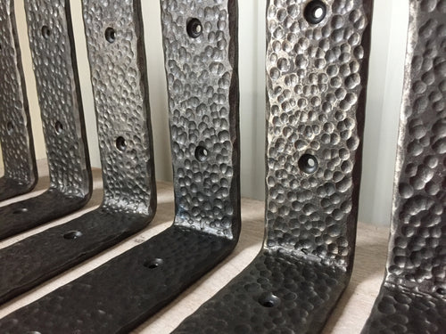 Custom Made by Mitty's Metal Art - www.mittysmetalart.com - These metal shelf brackets are individually hand-forged, shaped and textured. 